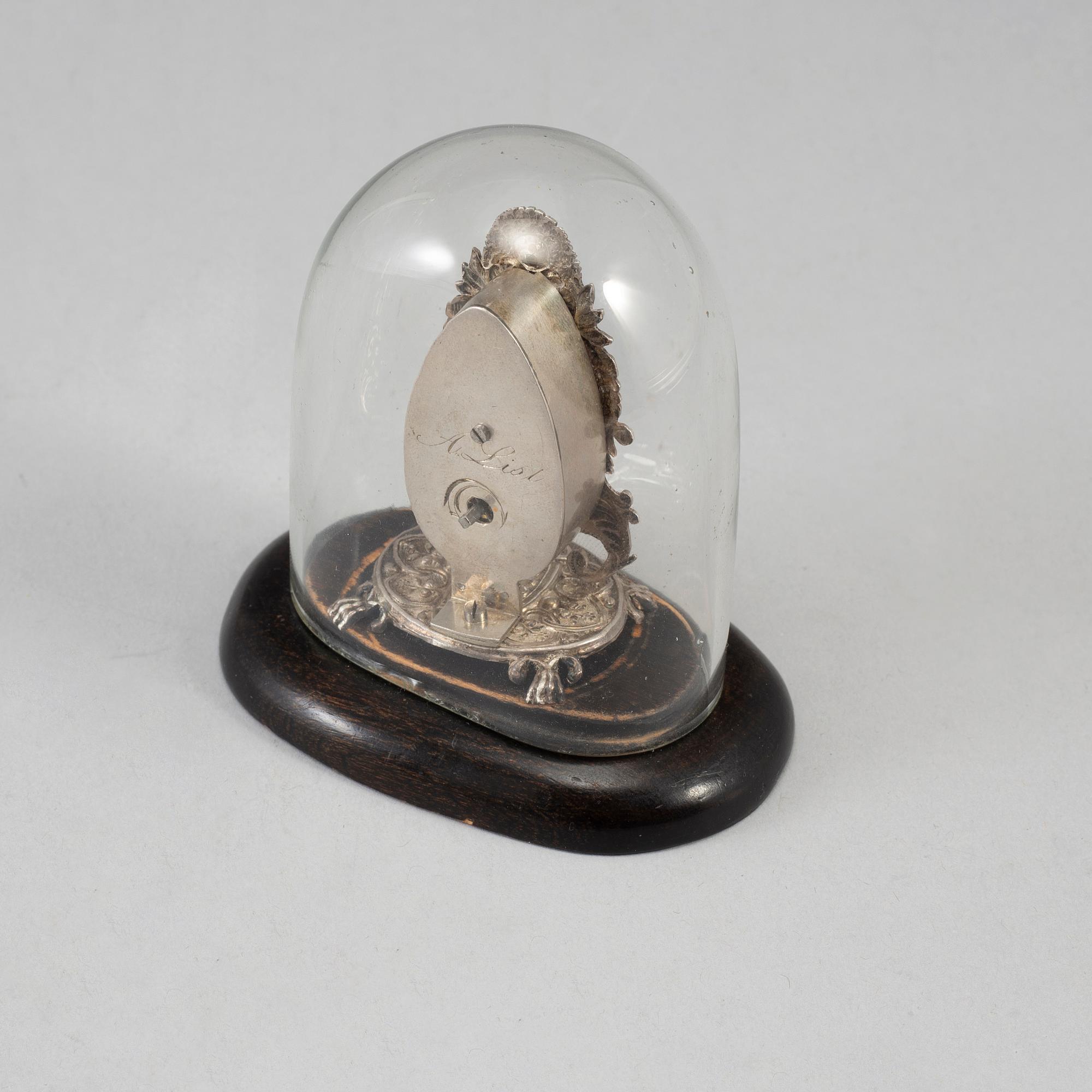 A 19th century miniature silver mantle clock.