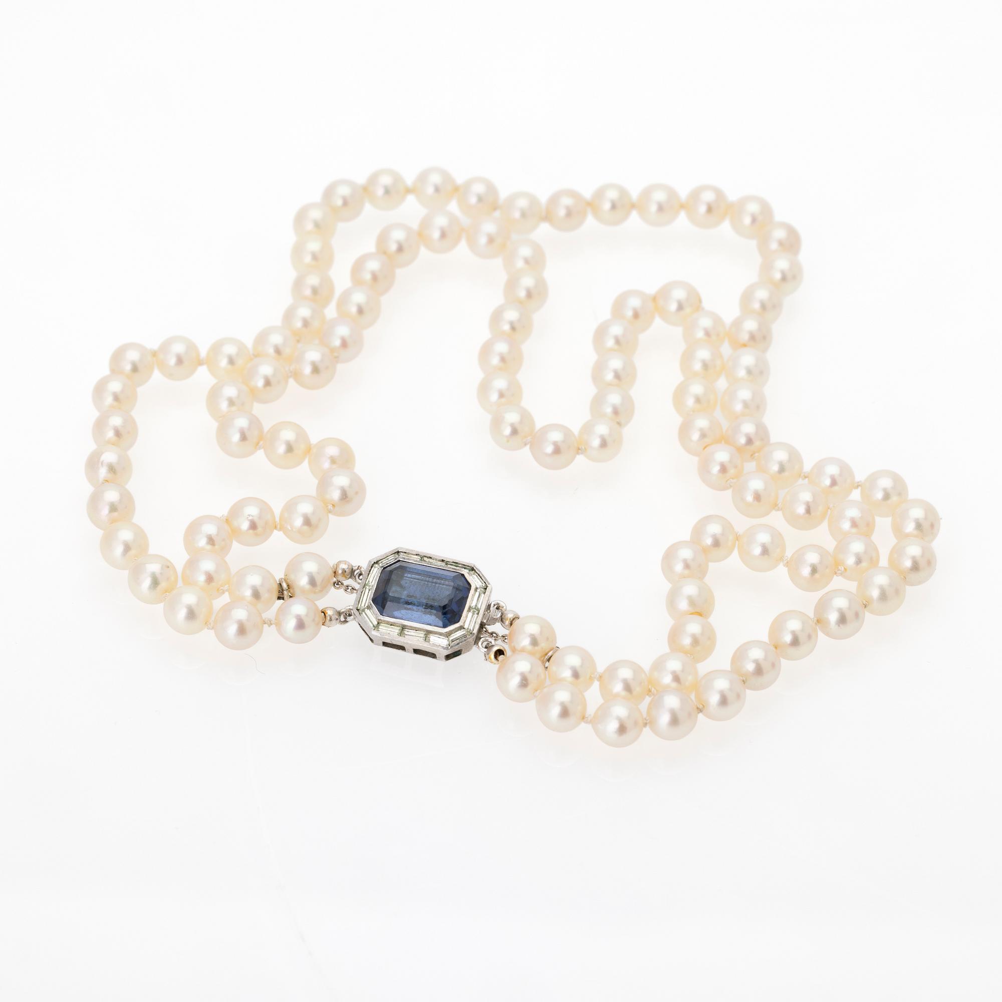Two-row cultured pearl necklace with a silver and glass clasp.