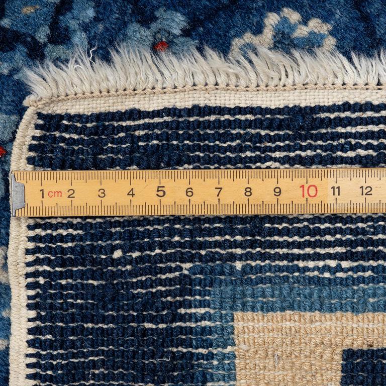 A semi-antique Baotou carpet, West China, c. 335 x 246 cm.