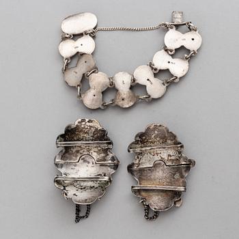 A Russian silver and niello bracelet and two belt buckles, unidentified makers mark, Kiev 1896-1908 and other.
