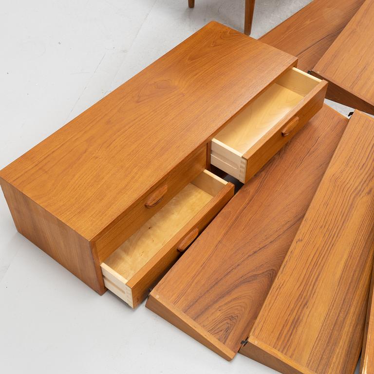 A teak and teak veneered shelf system, mid 20th century.