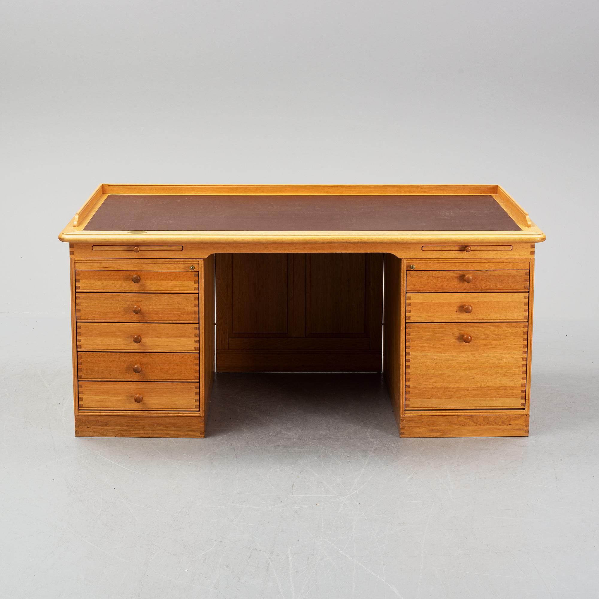 An oak writing desk by Finn N Hansen. End of the 20th Century.