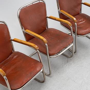 Three tubular steel armchairs, mid 20th Century.