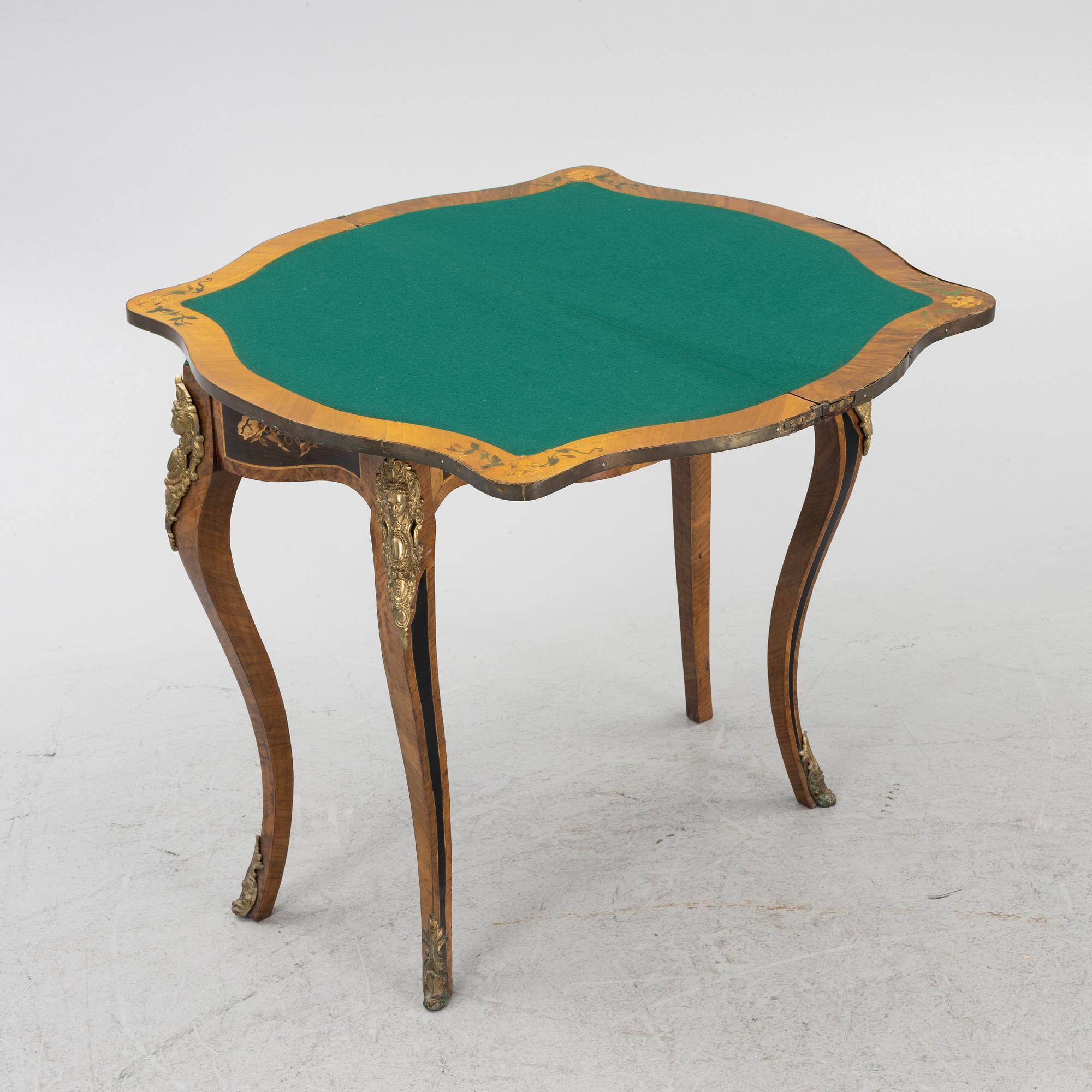 A Louis XV-style games table, early 20th century.