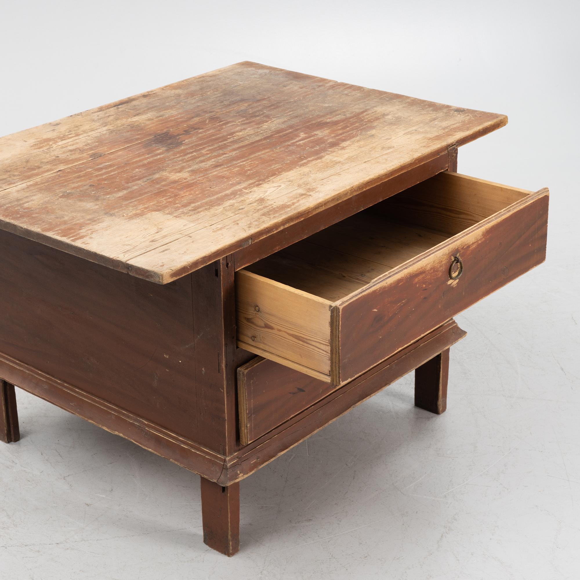 A painted table with drawers, 19th Century.