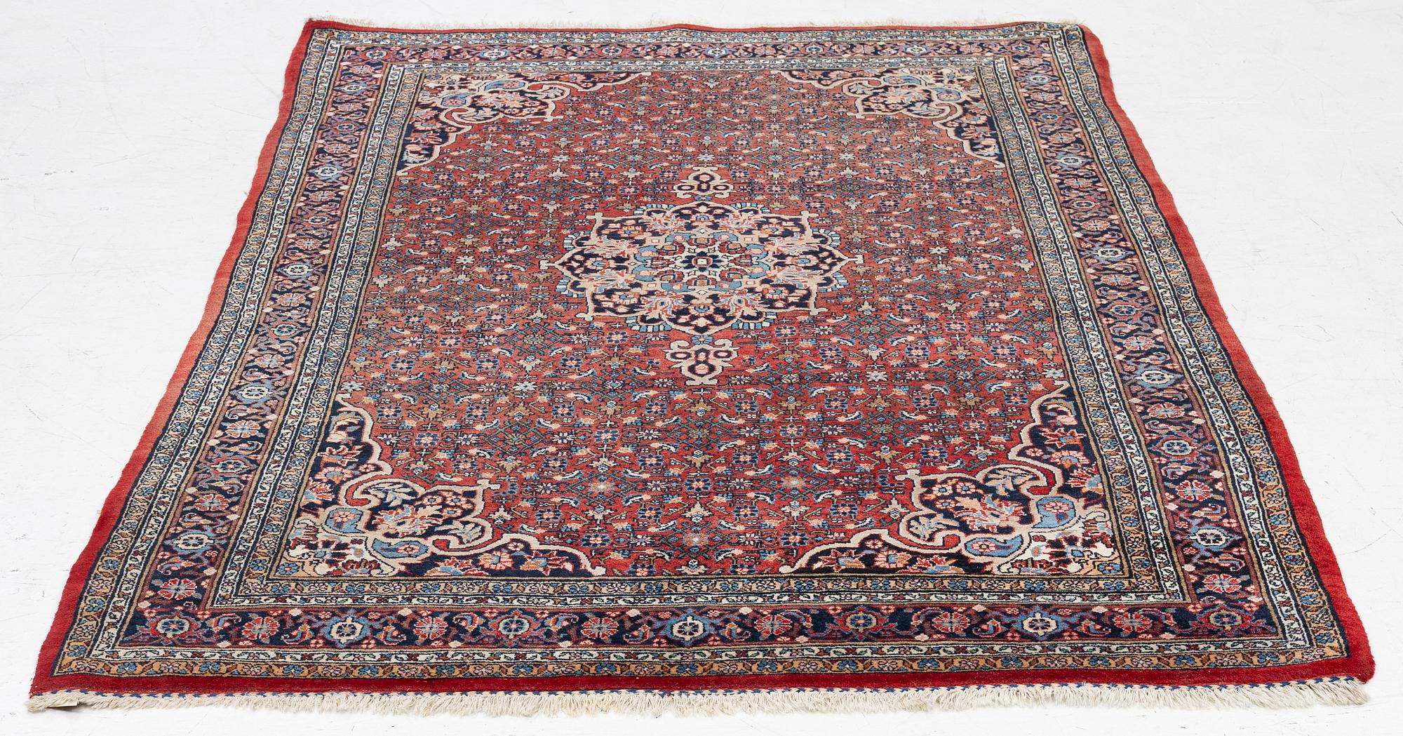 An old Bidjar rug, c. 225 x 143 cm.