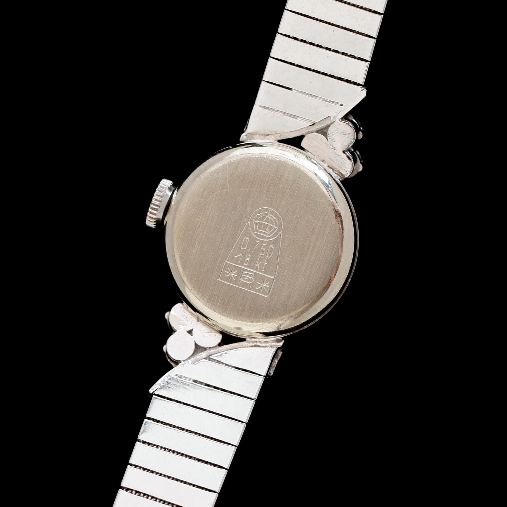 DAMARMBANDSUR, 18 k vitguld, briljantslipade diamanter tot ca 0.30 ct.
