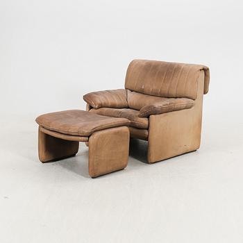 A leather armchair and fotstool by De Sede, Schweiz second half of the 20th century.