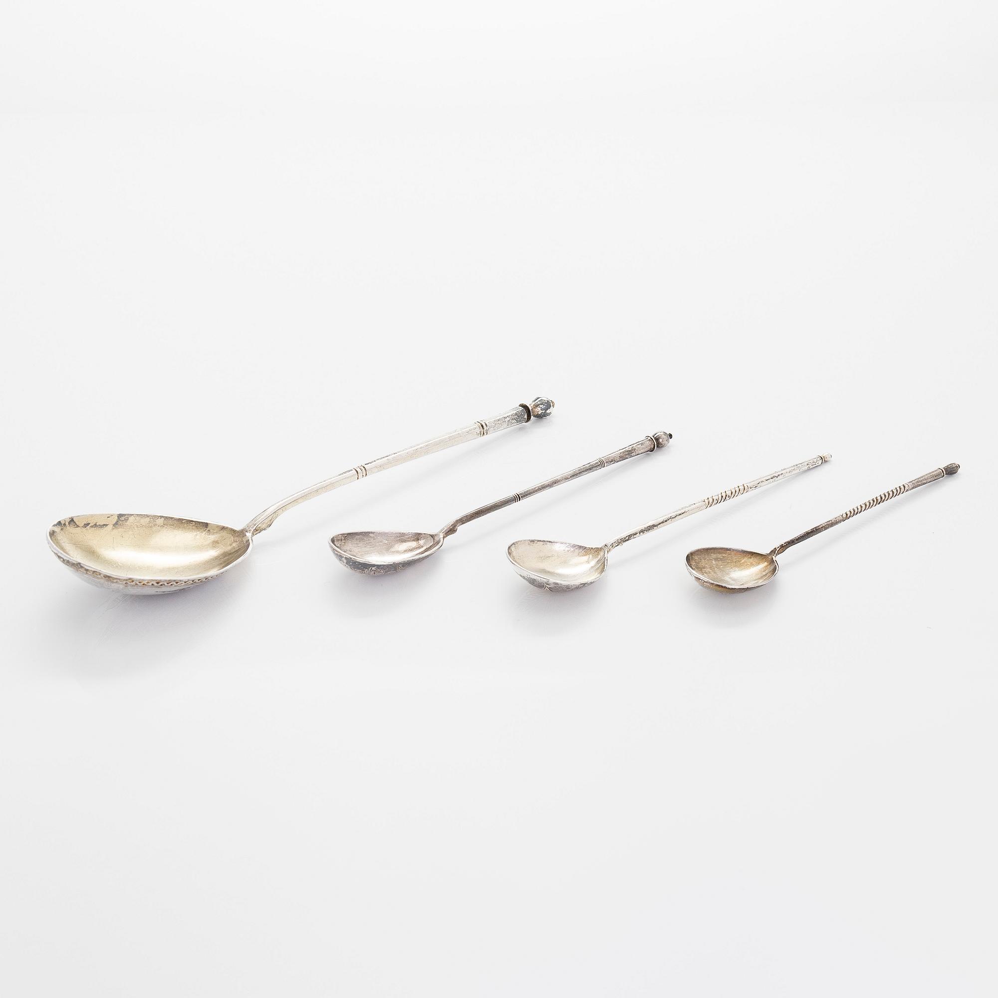 Three silver tea glass holders and four spoons, silver Kostroma and Moscow, late 19th and early 20th centuries.