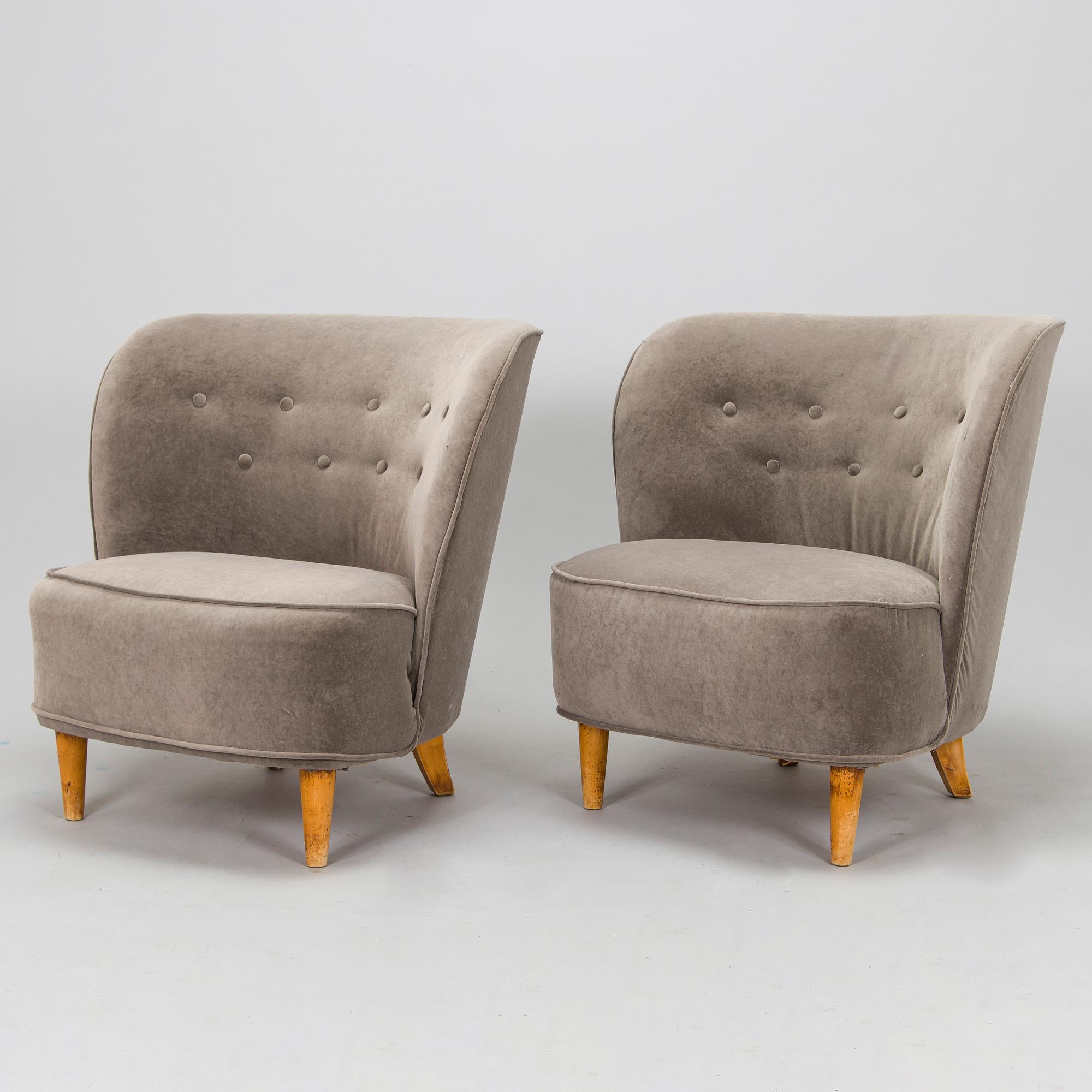A pair of mid 20th century armchairs.