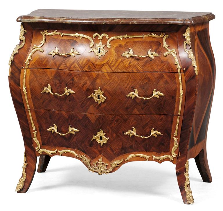 A Swedish Rococo commode attributed to J. J. Eisenbletter.