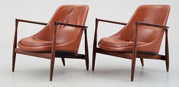 A pair of Ib Kofod Larsen 'Elisabeth' palisander and brown leather easy chairs.