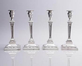 Four early 20th century silver candlesticks, marks of Hawksworth, Eyre & Co Ltd, Sheffield, England 1904-1906.