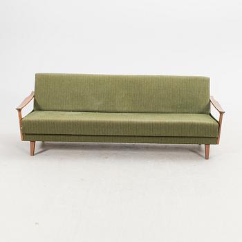 A 1960s teak sofa bed.