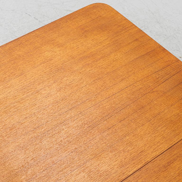 A mid20th century dining table.