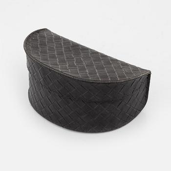 Bottega Veneta, a pair of sunglasses.