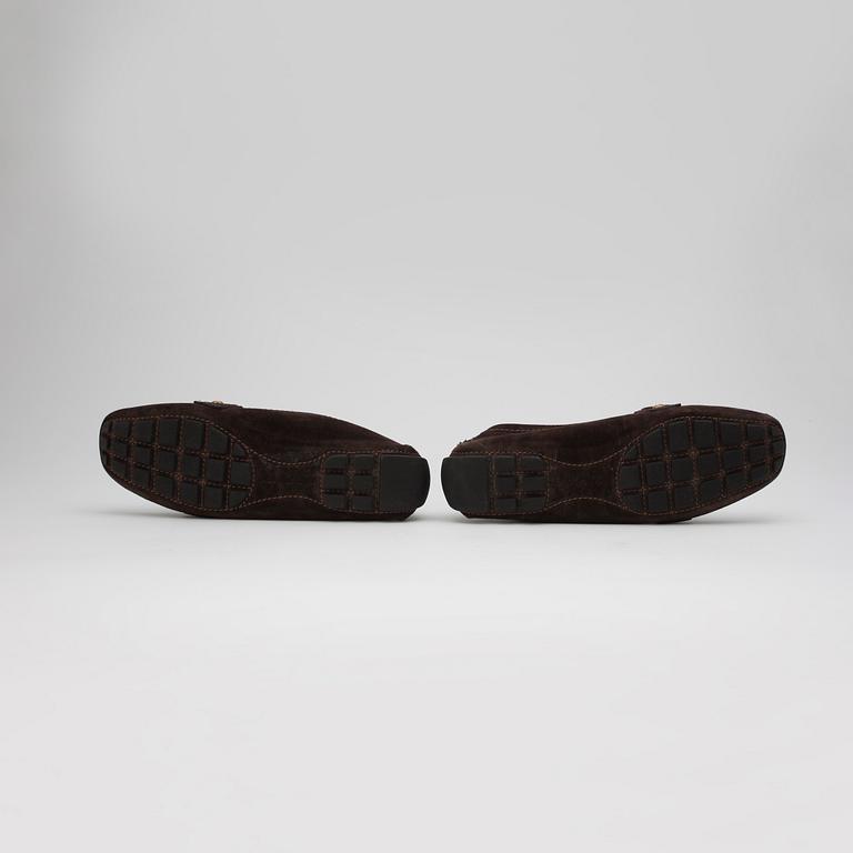 LOUIS VUITTON, a pair of brown suede loafers.