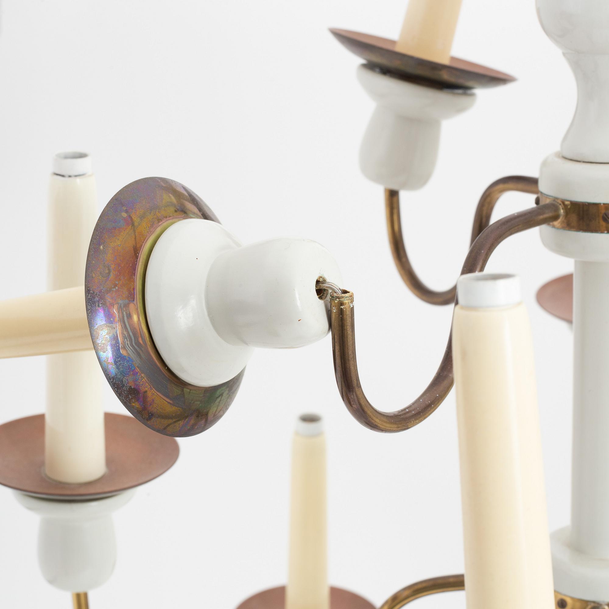A painted wood and brass model 2586 candelabra by Josef Frank for Firma Svenskt Tenn.