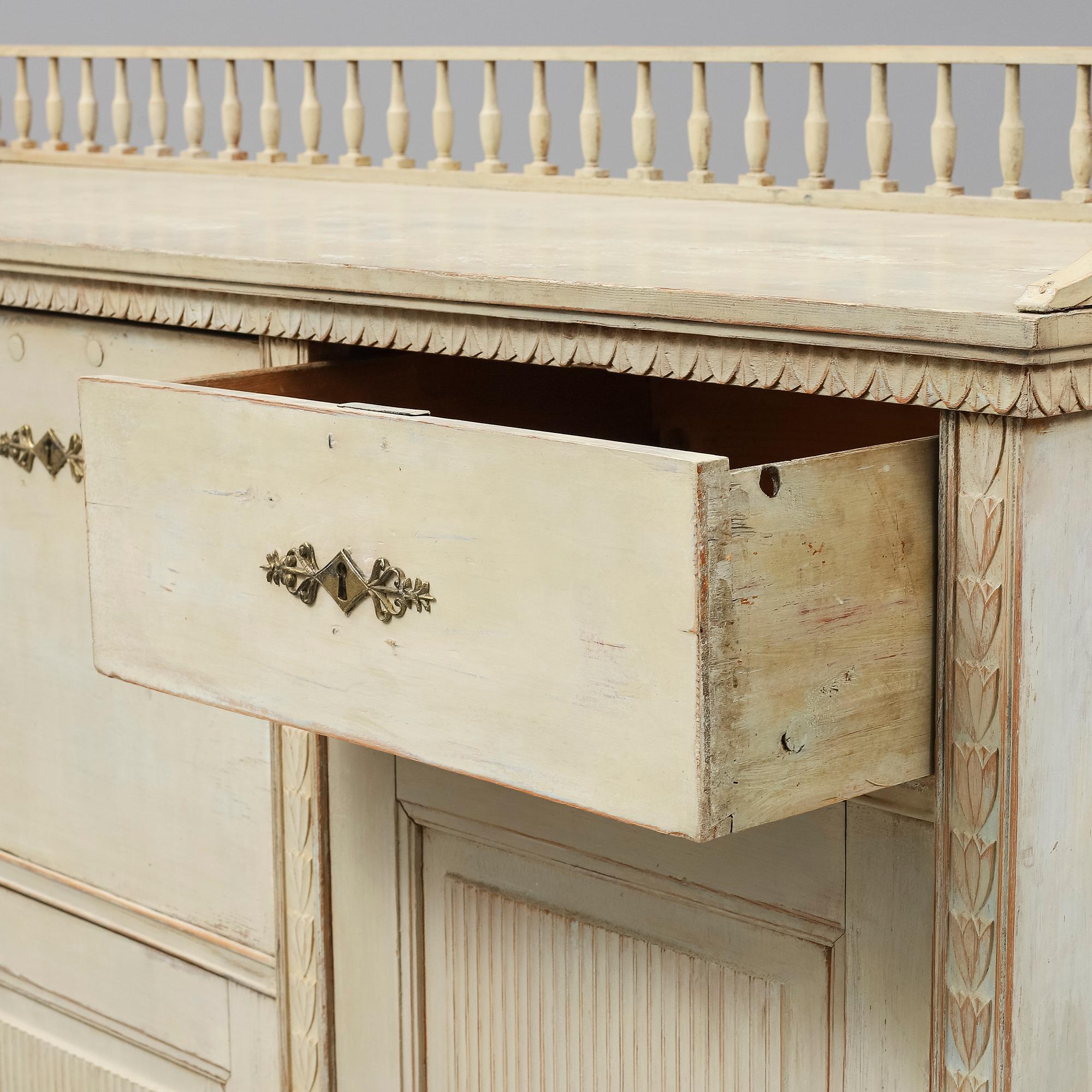 An early 19th Century painted late Gustavian cupboard.