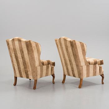 A pair of easy chairs and a foot stool, about 2000.