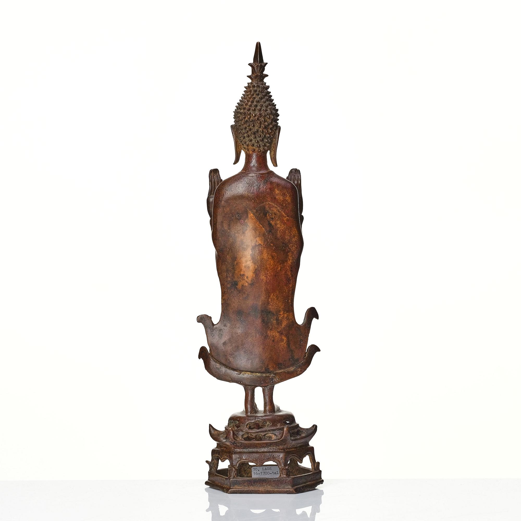 A standing sculpture of buddha, Laos, 18th Century.