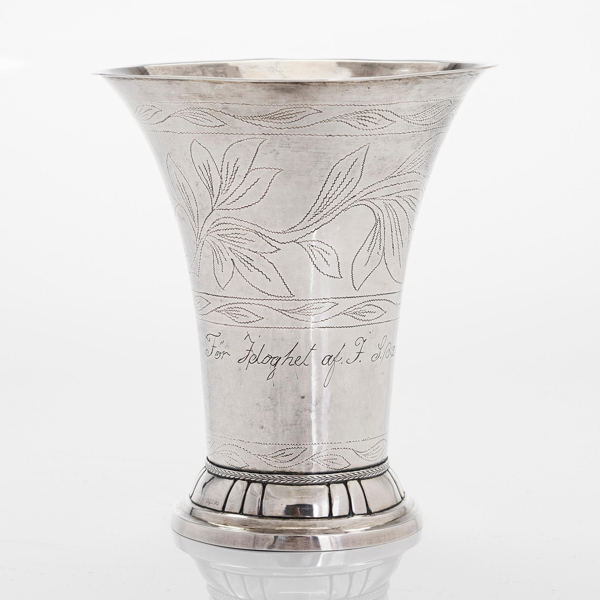 A silver beaker, maker's mark Isak Carlstedt, Porvoo ca. 1831, and silver spoon by Carl Fredrik Borgström, Turku 1803.