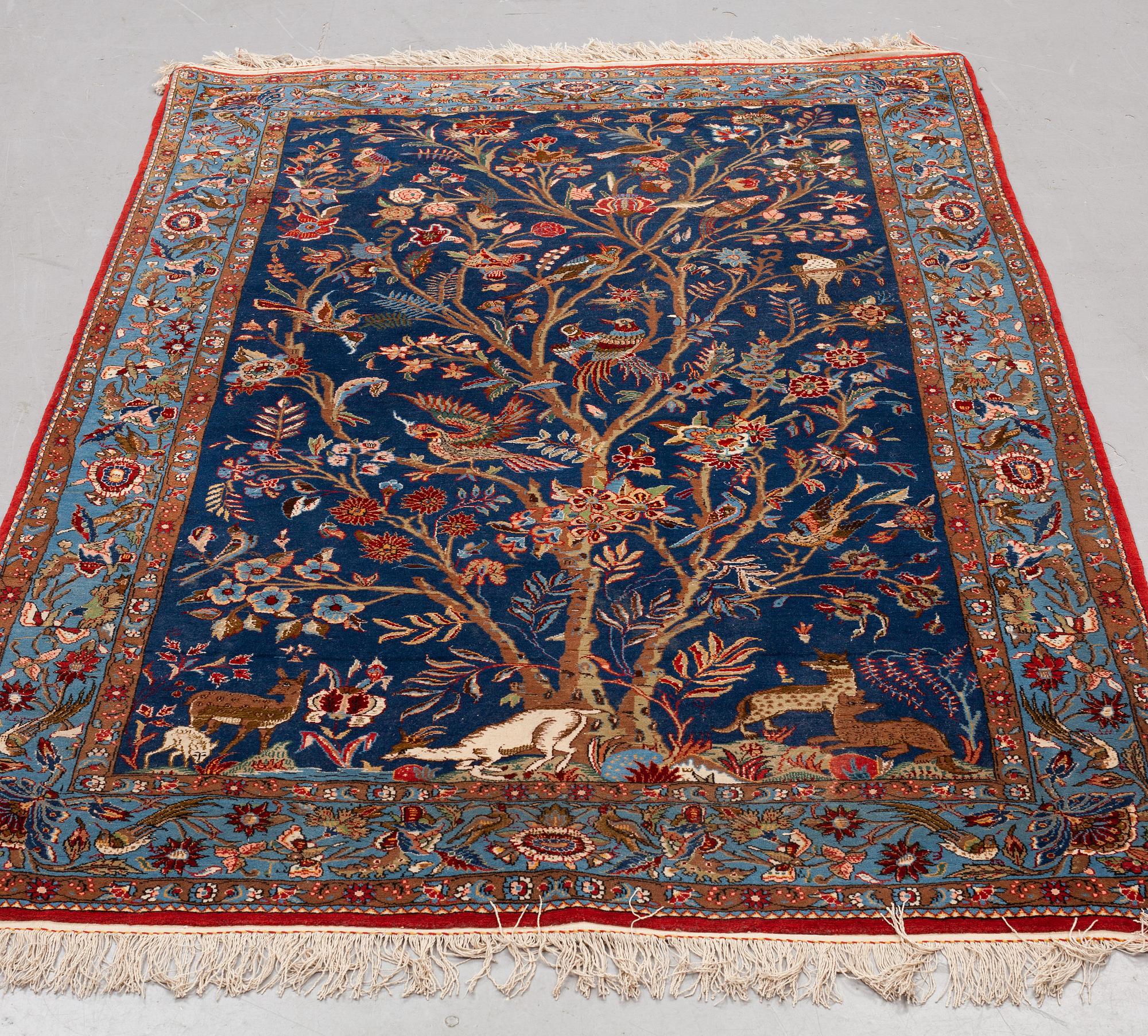A carpet, semi-antique Qum, figural, ca 195 x 130 cm.