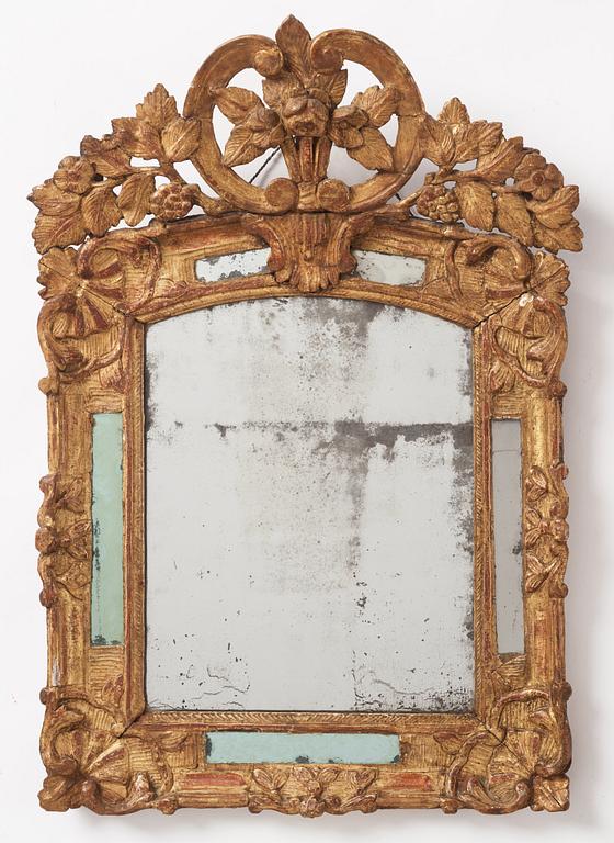 A presumably French Régence giltwood mirror, first part 18th century.