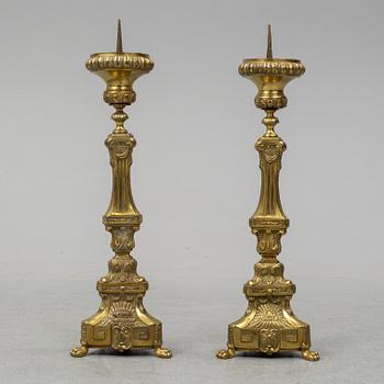 A pair of 18th century brass floor candlesticks.