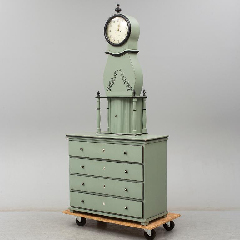 A combined clock and chest of drawers from late 19th  century.