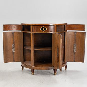 A pair of mahogany veneered empire style cabinets.