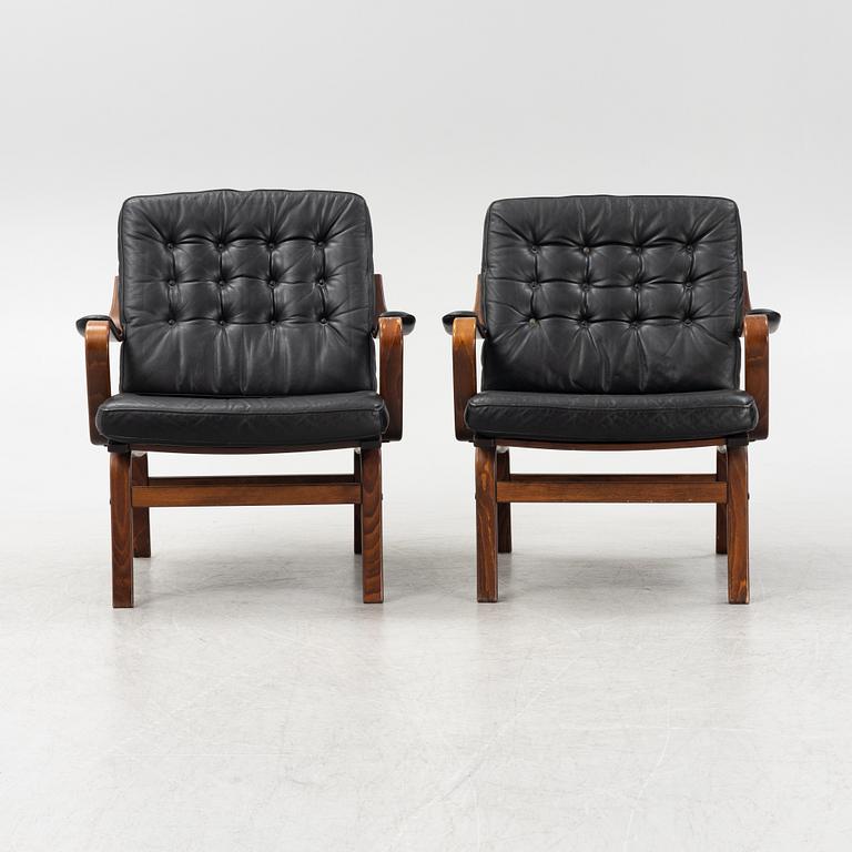 A pair of beechwood and leather armchairs, Göte Möbler, Nässjö, Sweden, second half of the 20th century.