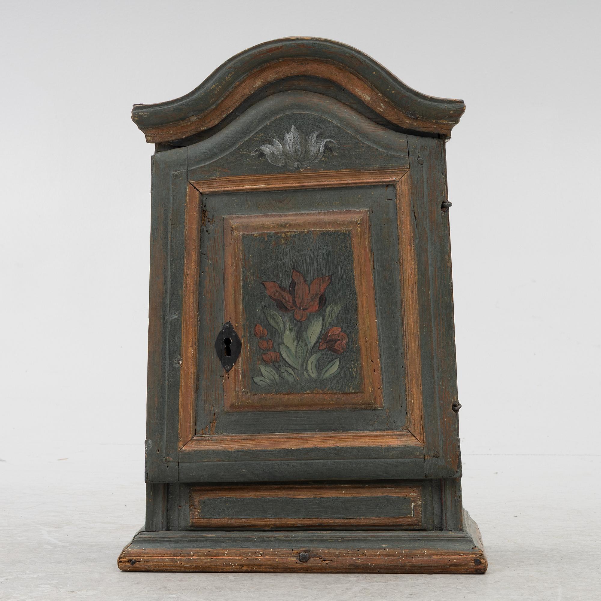 A painted wall cabinet, 19th century.