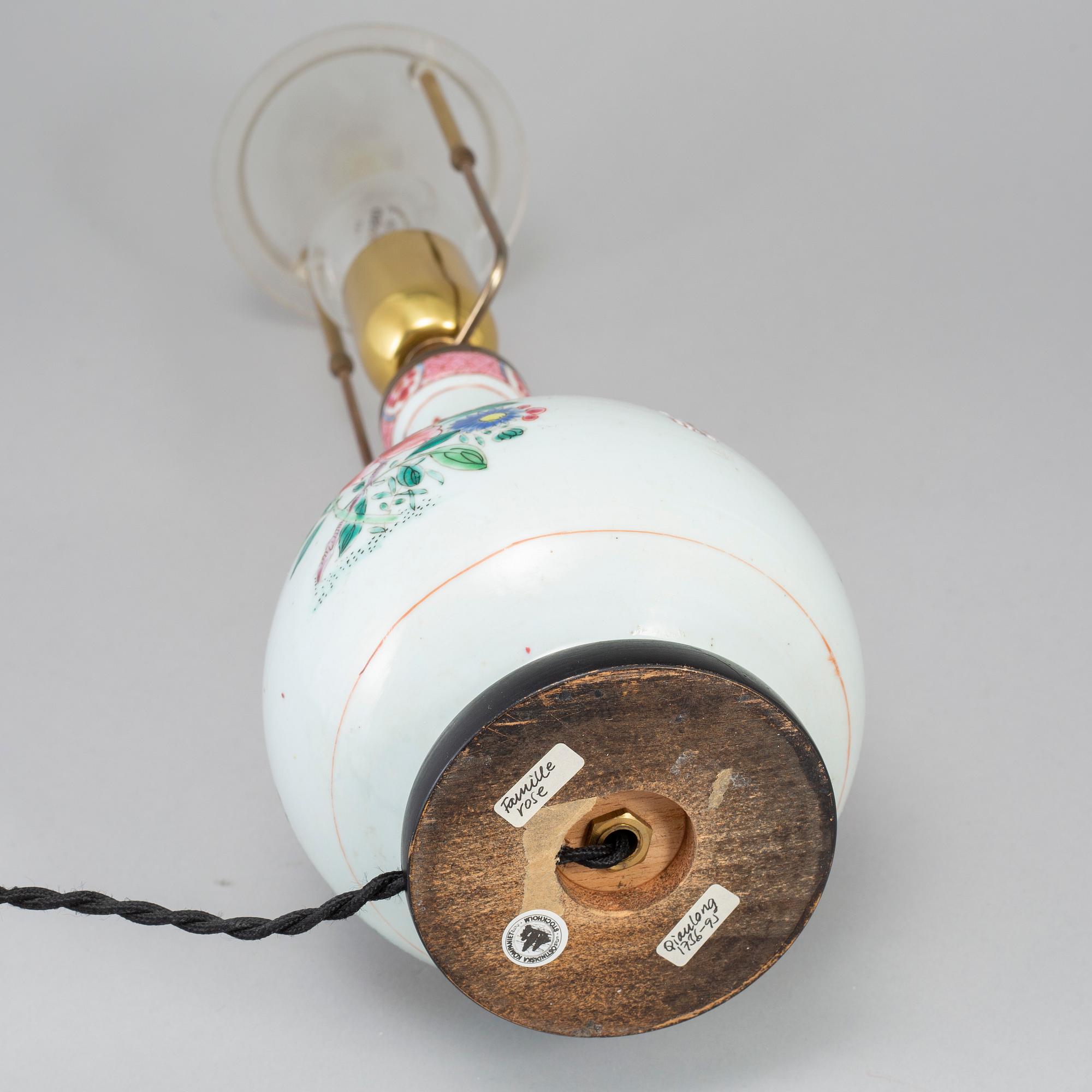 A famille rose bottle vase, Qing dynasty, 18th Century. Mounted as a lamp.