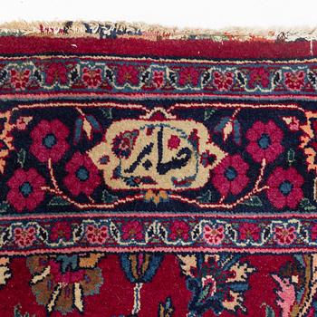 A semi-antik Mashad, signed Saber, carpet, ca 460 x 152 cm.