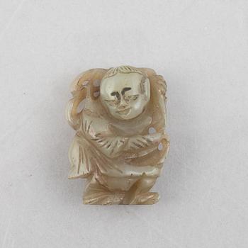 A group of four Chinese stone charms, 20th century.