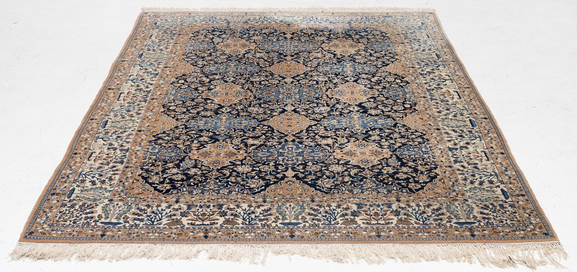 A semi-antique Nain carpet, part-silk, c. 261 x 175 cm.