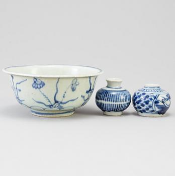 A blue and white Chinese porcelain bowl and two miniature jars for the South East Asian market, probably Ming dynasty.