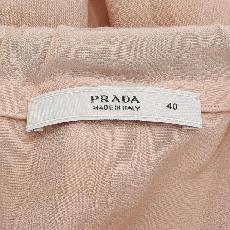 PRADA, a powder pink blouse with black ribbon. Size 40.