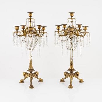 A pair of bronze candelabra, late 19th Century.