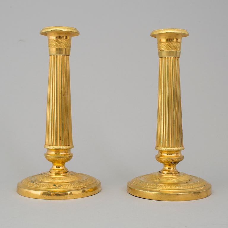 A PAIR OF EMPIRE CANDLESTICKS, first half of the 19th century.