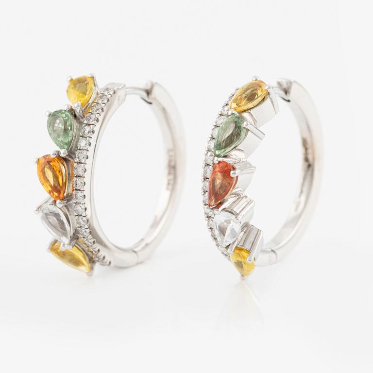 A pair of 14K gold earrings with multicoloured sapphires and diamonds.