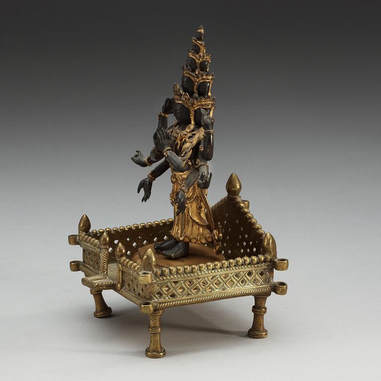 A gilt bronze figure of eleven-faced Avalokiteshvara, Tibet/Nepal, 19th Century.