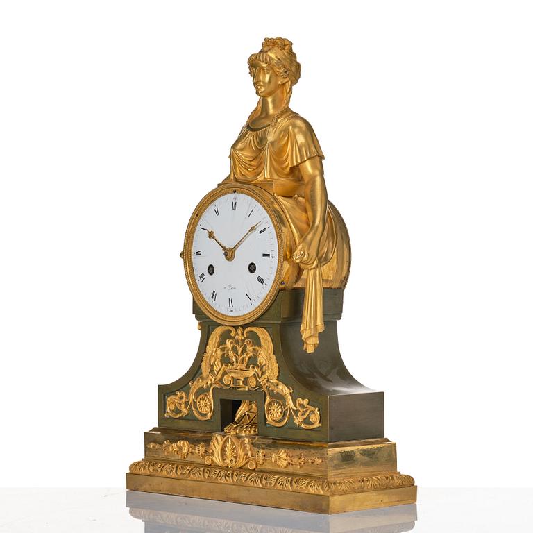 An Empire bronze mantle clock.