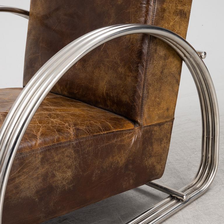 A pair of 'Hudson Street' lounge chairs from Ralph Lauren home.