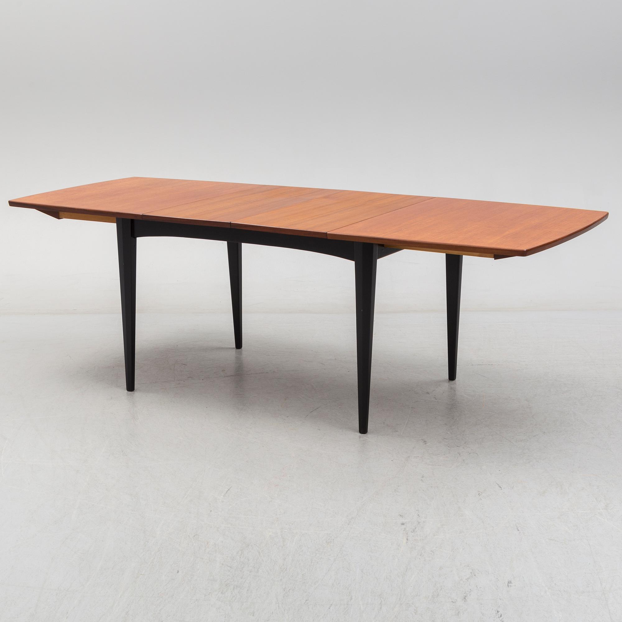 A 1950s/1960s teak and teak veneer table.