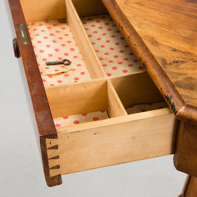 A 19th century sewing table.