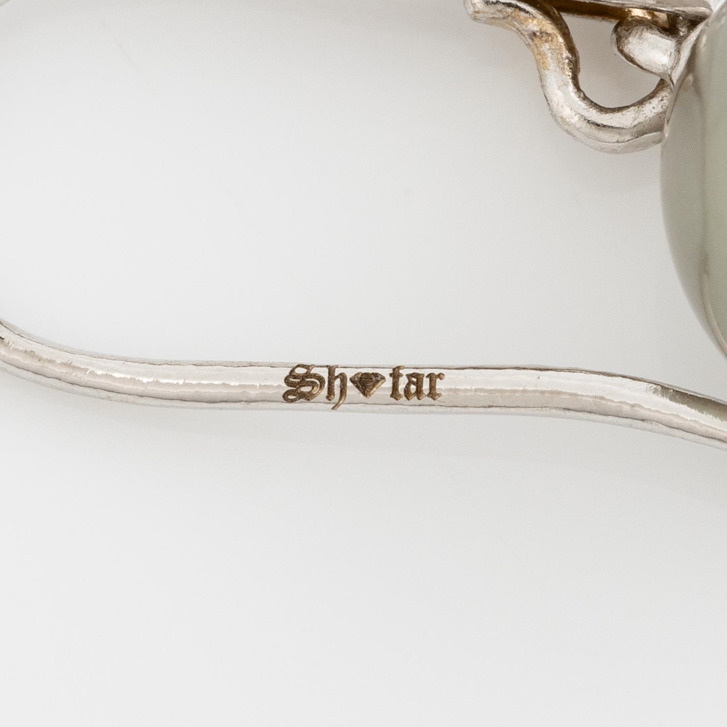 Earrings 14K white gold with cultured Tahitian pearls.