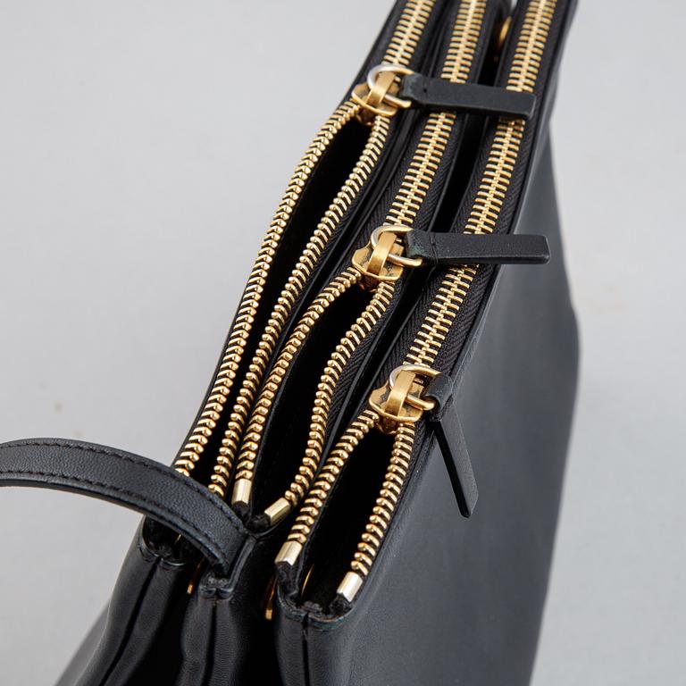 Céline, a black leather 'Trio Bag'.