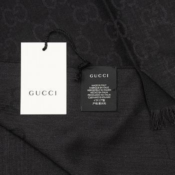 Gucci, a wool and silk mix "GG" jaquard shawl.